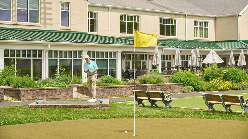 Foulkeways Resident at chip and putt