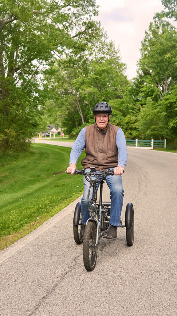 Foulkeways Resident on electric cycle