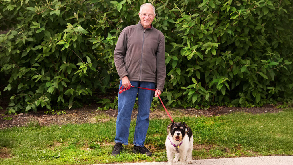 Foulkeways resident walking dog