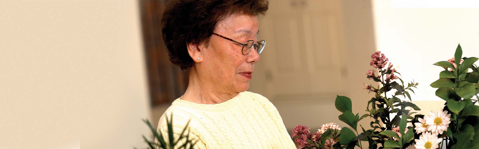 Resident at Foulkeways arranging flowers